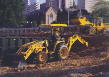 Árokásó-rakodók John Deere Construction 110