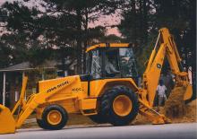Árokásó-rakodók John Deere Construction 710 B