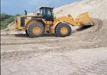 Gumikerekes homlokrakodók Caterpillar 980 G II