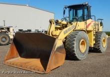 Gumikerekes homlokrakodók New Holland LW230