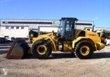 Gumikerekes homlokrakodók New Holland W230C