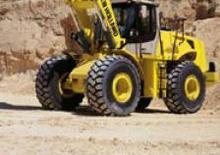 Gumikerekes homlokrakodók New Holland W 230 Evolution