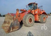Gumikerekes homlokrakodók Fiat Kobelco W 270