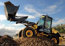 Gumikerekes homlokrakodók New Holland W 60
