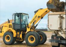 Gumikerekes homlokrakodók New Holland W110B