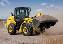 Gumikerekes homlokrakodók New Holland W100C LR