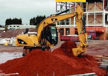 Gumikerekes kotrók Caterpillar M313D